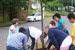 2 students placing mulch on native plant